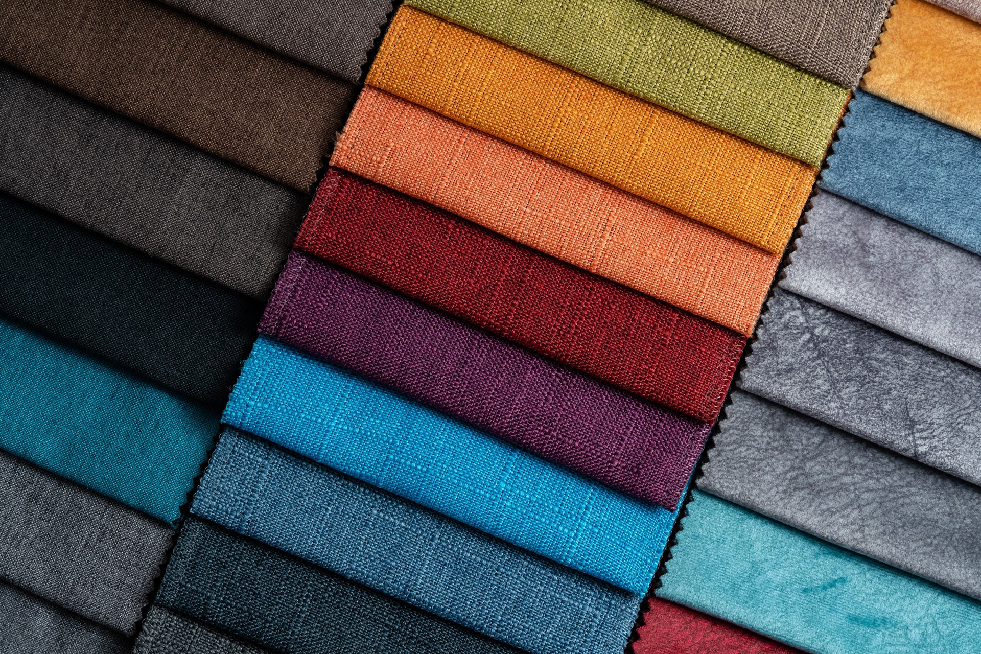 Fabric swatches offering variety of colors of upholstery material for furniture.